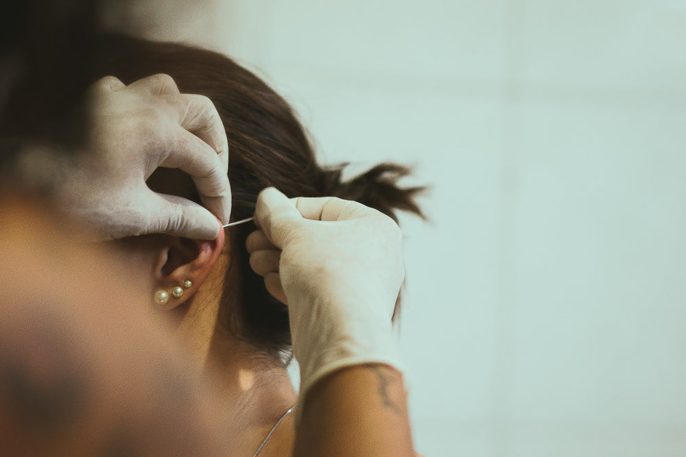 Needles Vs Ear-Piercing Instrument Piercings - The Big Debate - Caress Ltd