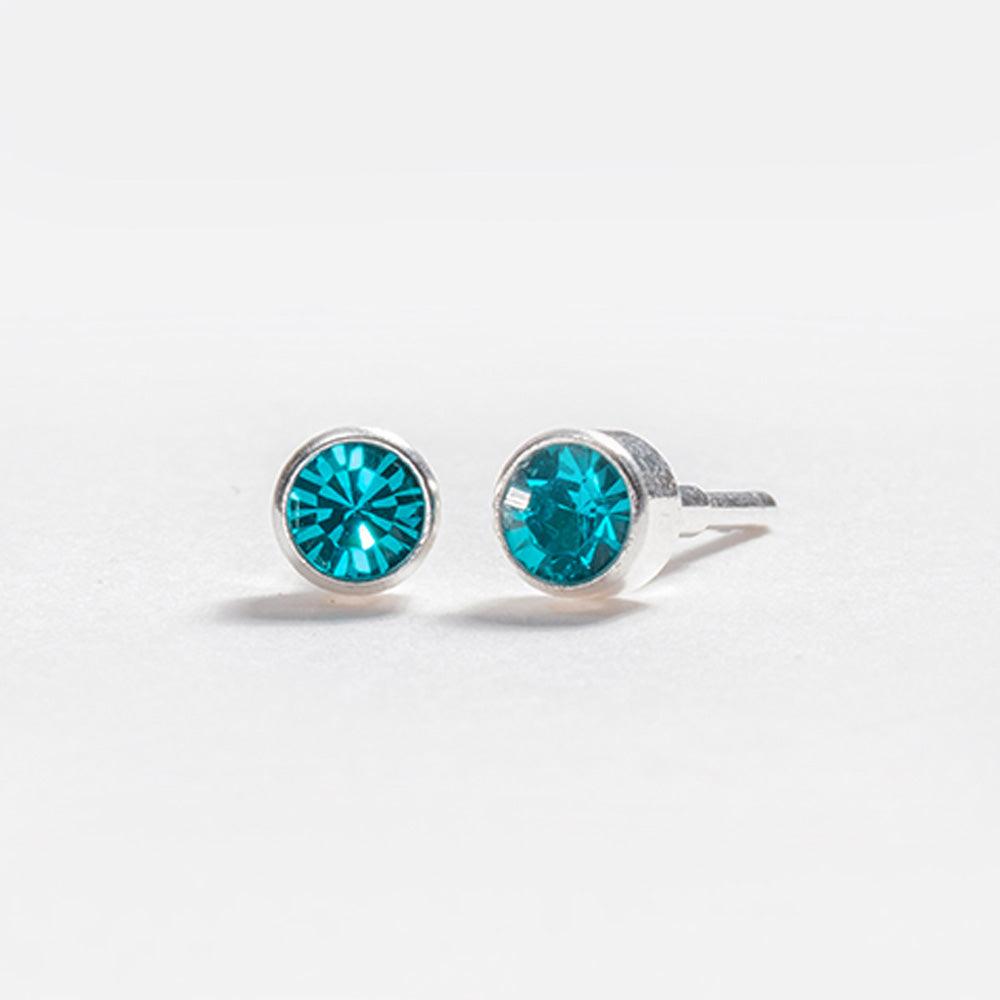 December – Blue Zircon Bezel Set - Caress Ltd