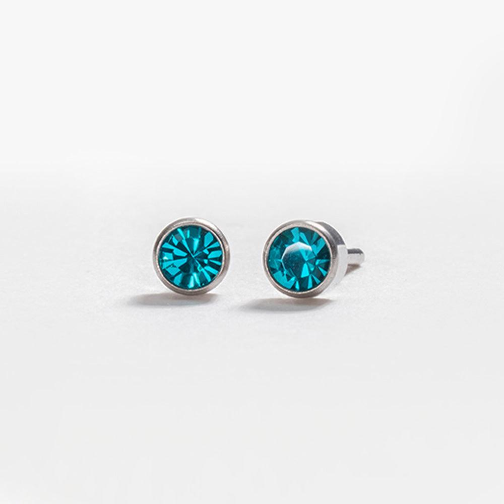 December – Blue Zircon Bezel Set - Caress Ltd